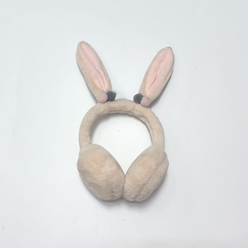 Cache-oreilles fausse fourrure beige très moelleux avec serre-tête souple sur fond blanc
