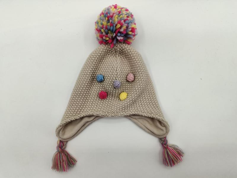 Bonnet tricot enfant beige à cache-oreilles
