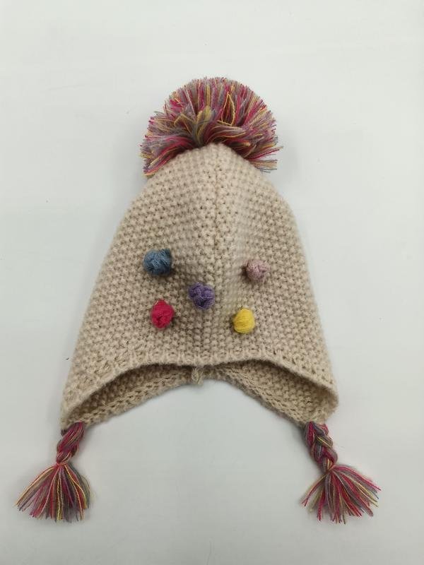 Bonnet bébé tricoté crème cache-oreilles avec gros pompon multicolore