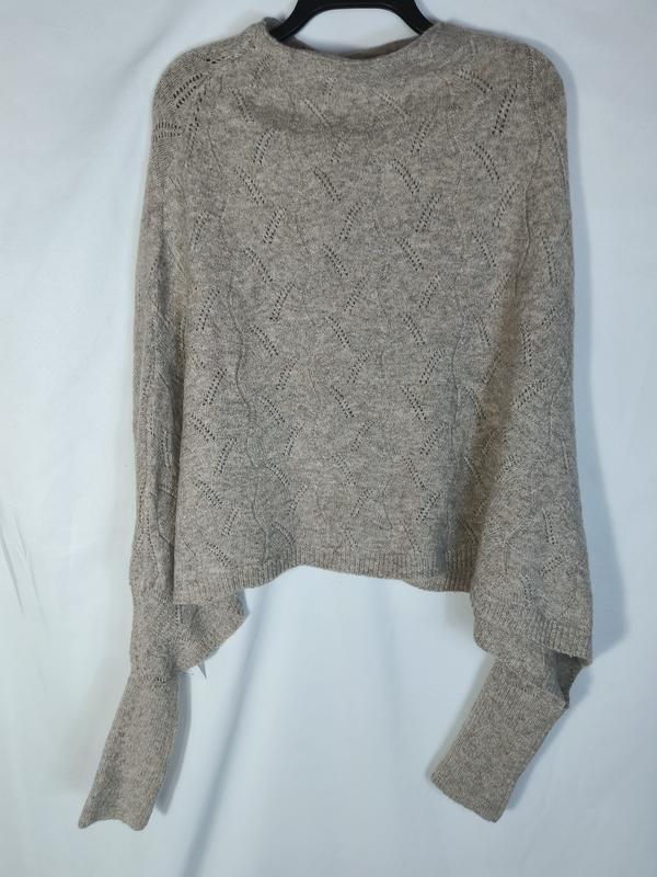 Crop top en maille pointelle beige avec motif losanges ajourés et manches longues